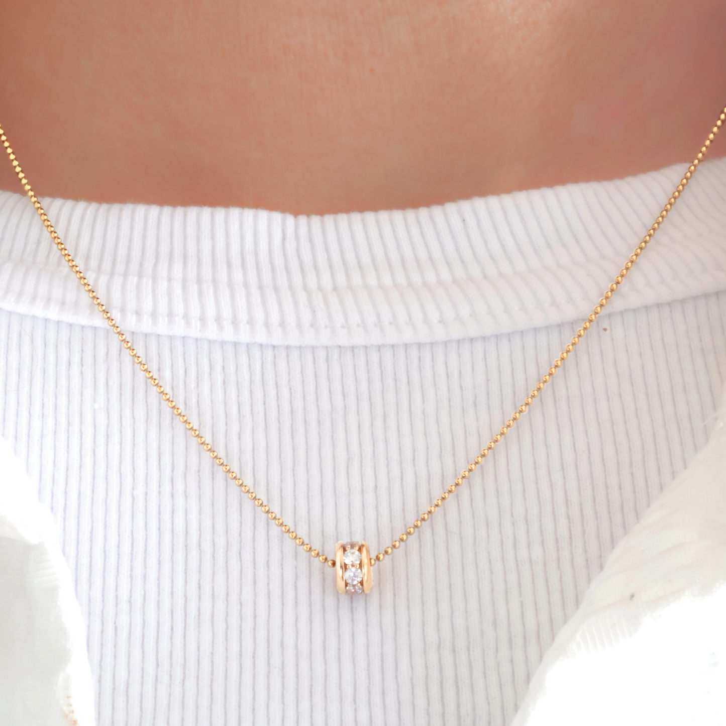 Féline - goldfilled bolletjes collier met 18-karaat goud verguld zirkonia wiel.