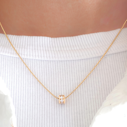 Féline - goldfilled bolletjes collier met 18-karaat goud verguld zirkonia wiel.