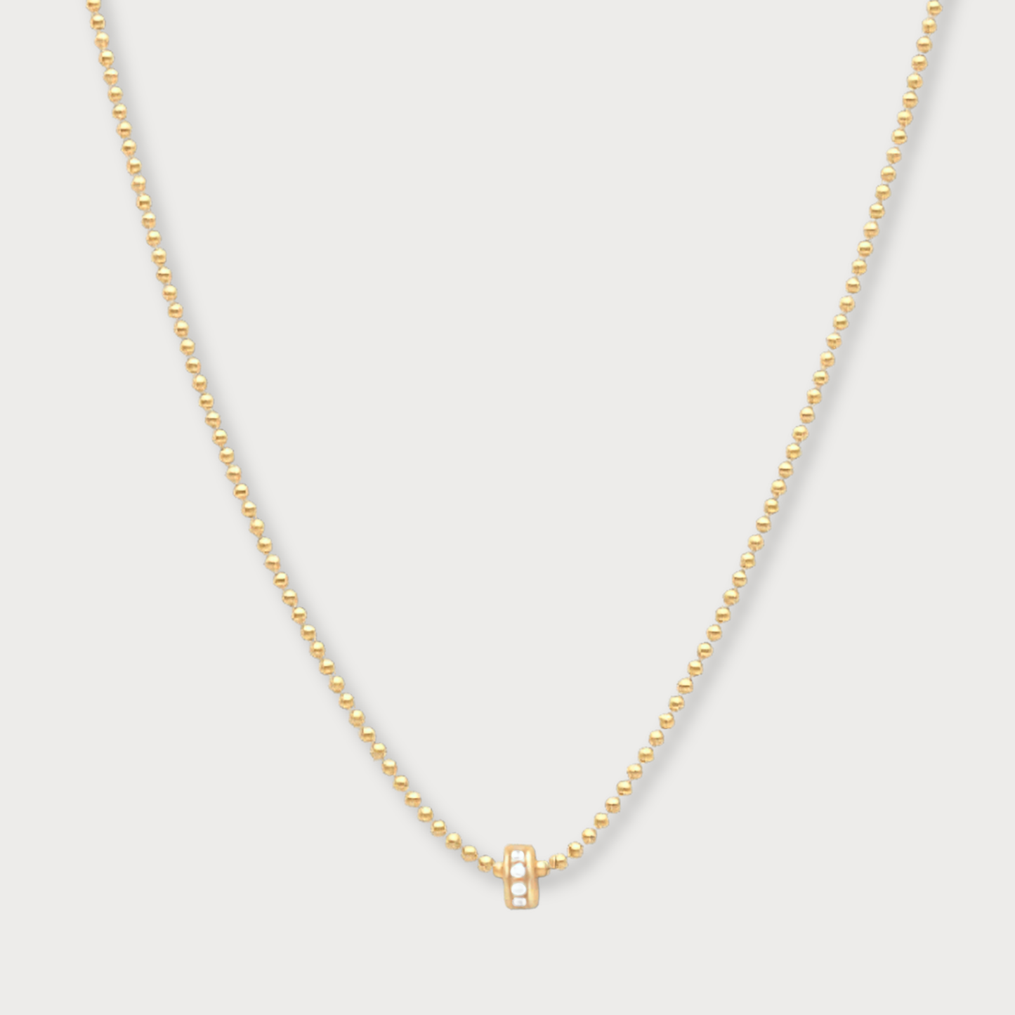 Aimée - goldfilled bolletjes collier met klein zirkonia wieltje